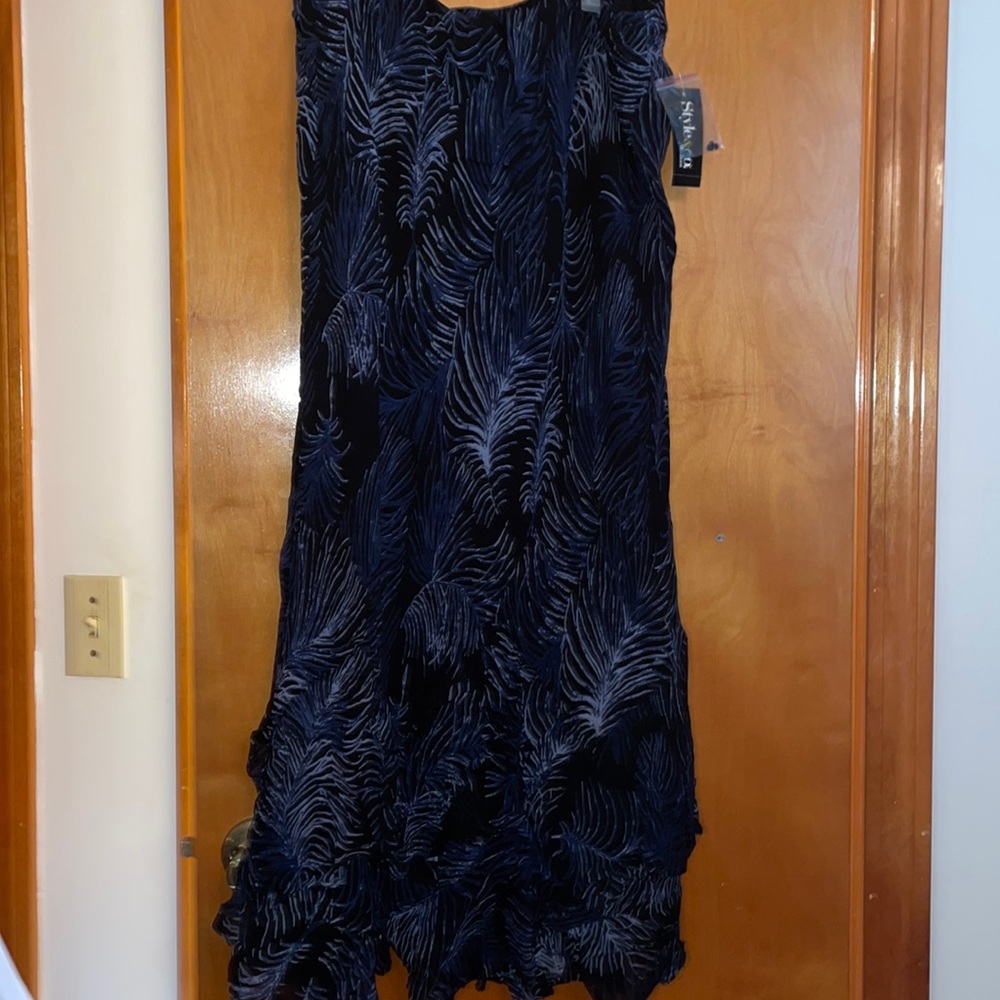 NWT lined printed skirt with asymmetrical ruffles on hem.